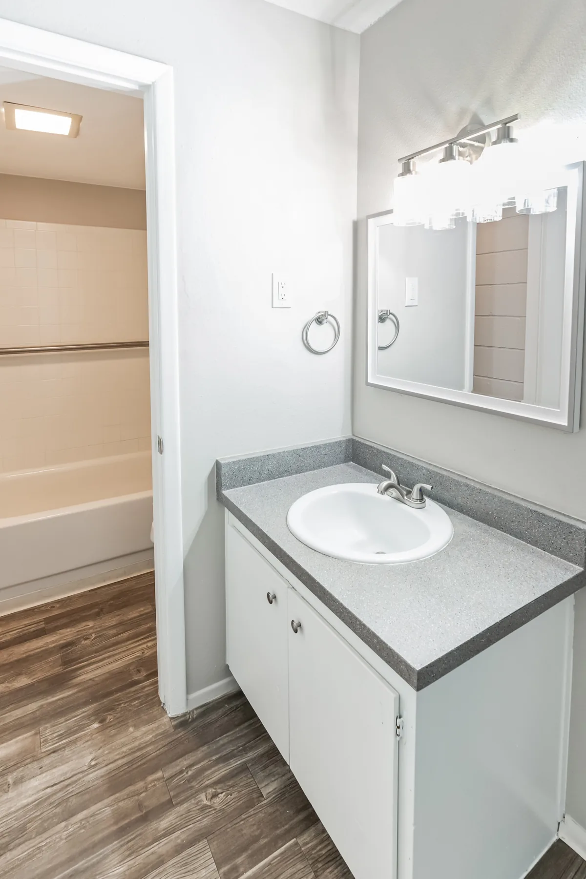 Bathroom vanity and mirror at Uptown Horizon Apartments